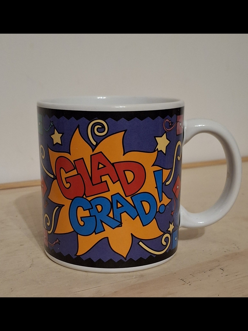 vintage 1990s "Glad Grad" mug, vibrant comic-style design with stars & confetti